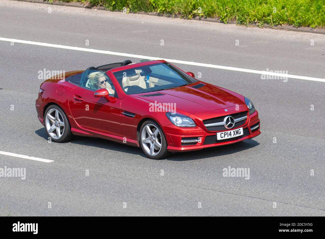 2008 silver Mercedes SLK 200 Kompressor Auto: Vehicular traffic moving  vehicles, convertible, convertibles soft-top, open topped roadster,  cabriolets, drop-tops, cars driving vehicle on UK roads, motors, motoring  on the M61 motorway highway