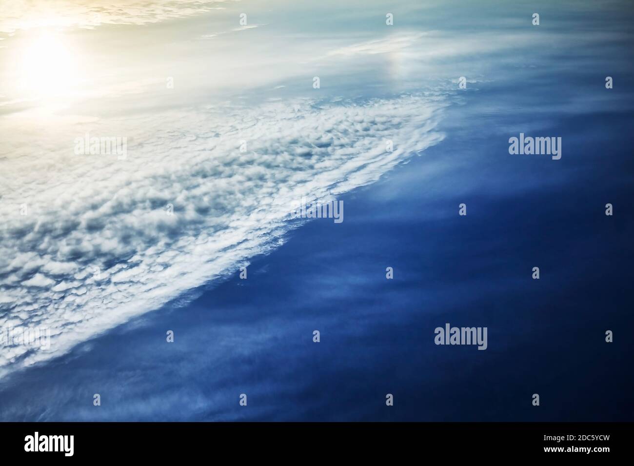 The blue sky with clouds and sun, background Stock Photo