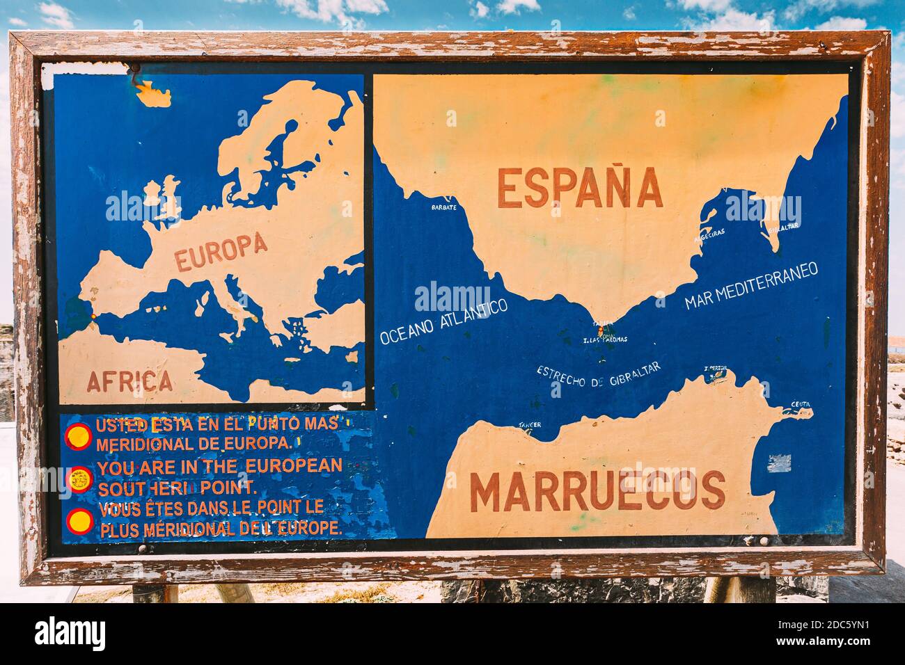 Old painted Information board on the beach Costa de la Luz in Tarifa, Spain. Stock Photo
