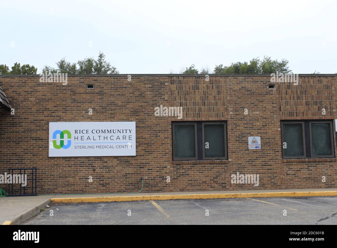 Sterling Medical Center with blue sky and tree's with the parking lot