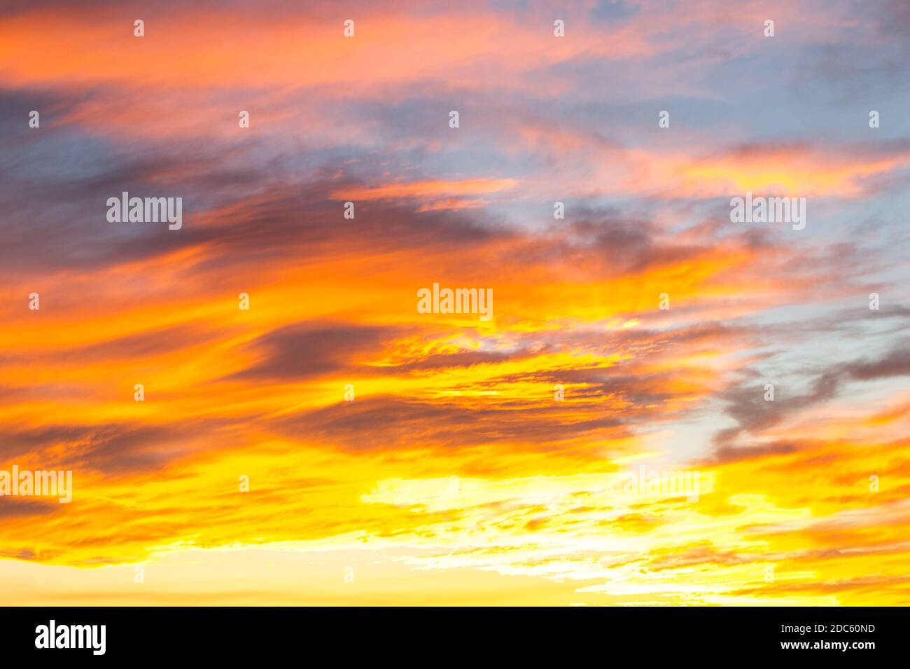 Dramatic yellow and orange colored sunset cloudscape for background or sky  replacement photo editing. Beauty in nature Stock Photo - Alamy