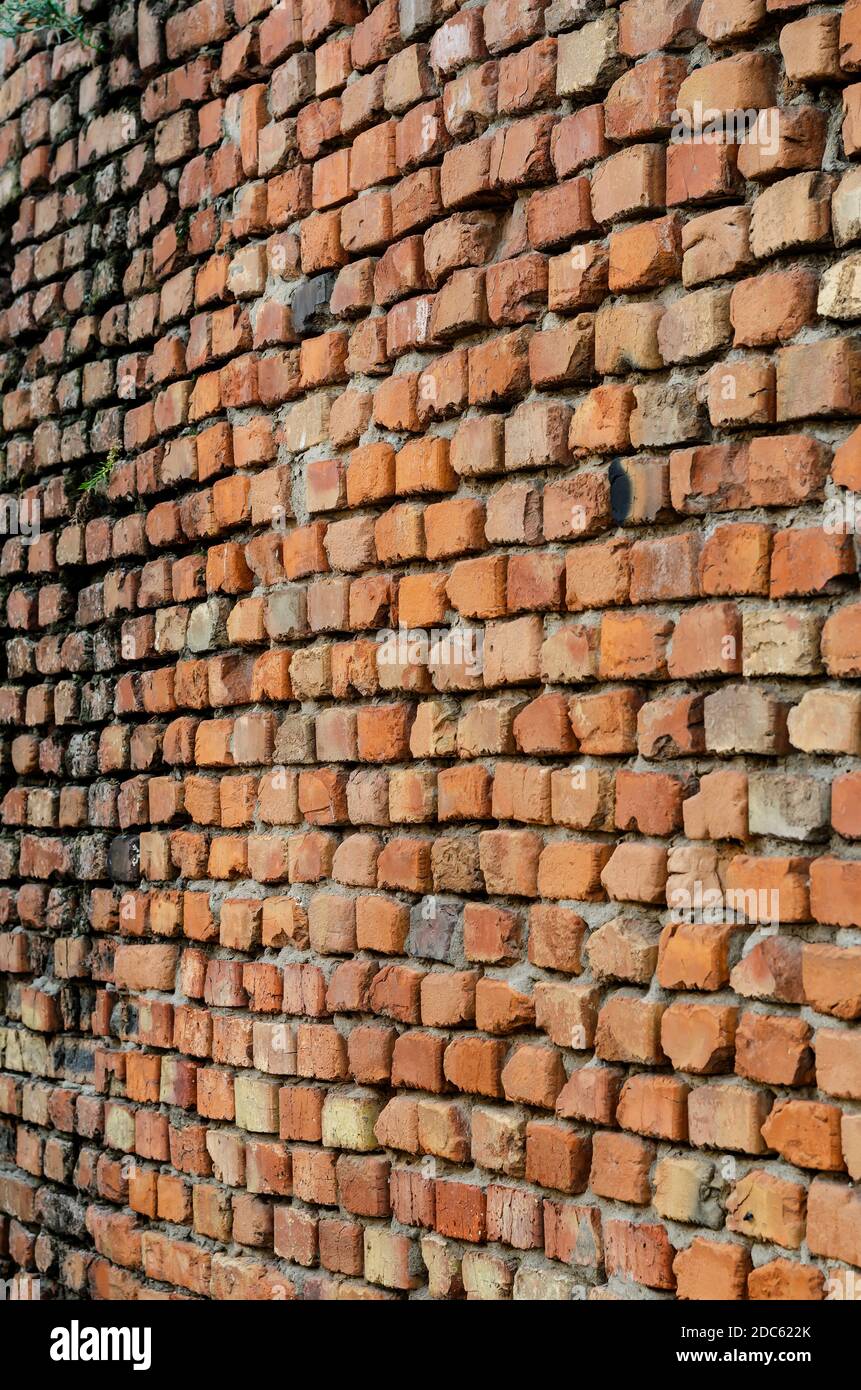 Geometric composition of rectangular clay bricks. Red brick wall ...