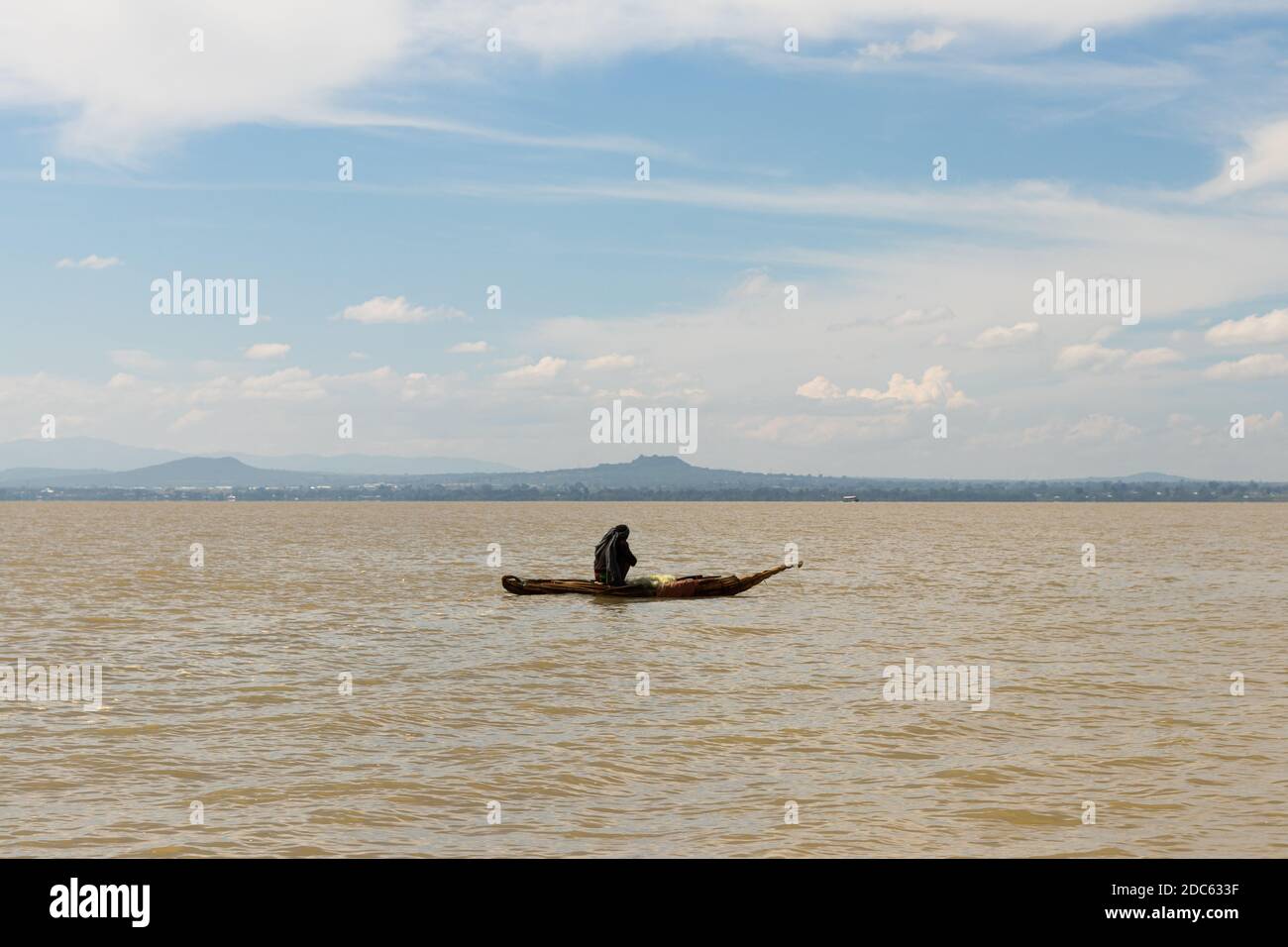 African fisherman in papyrus boat/wooden boat on lake tana in Ethiopia Stock Photo