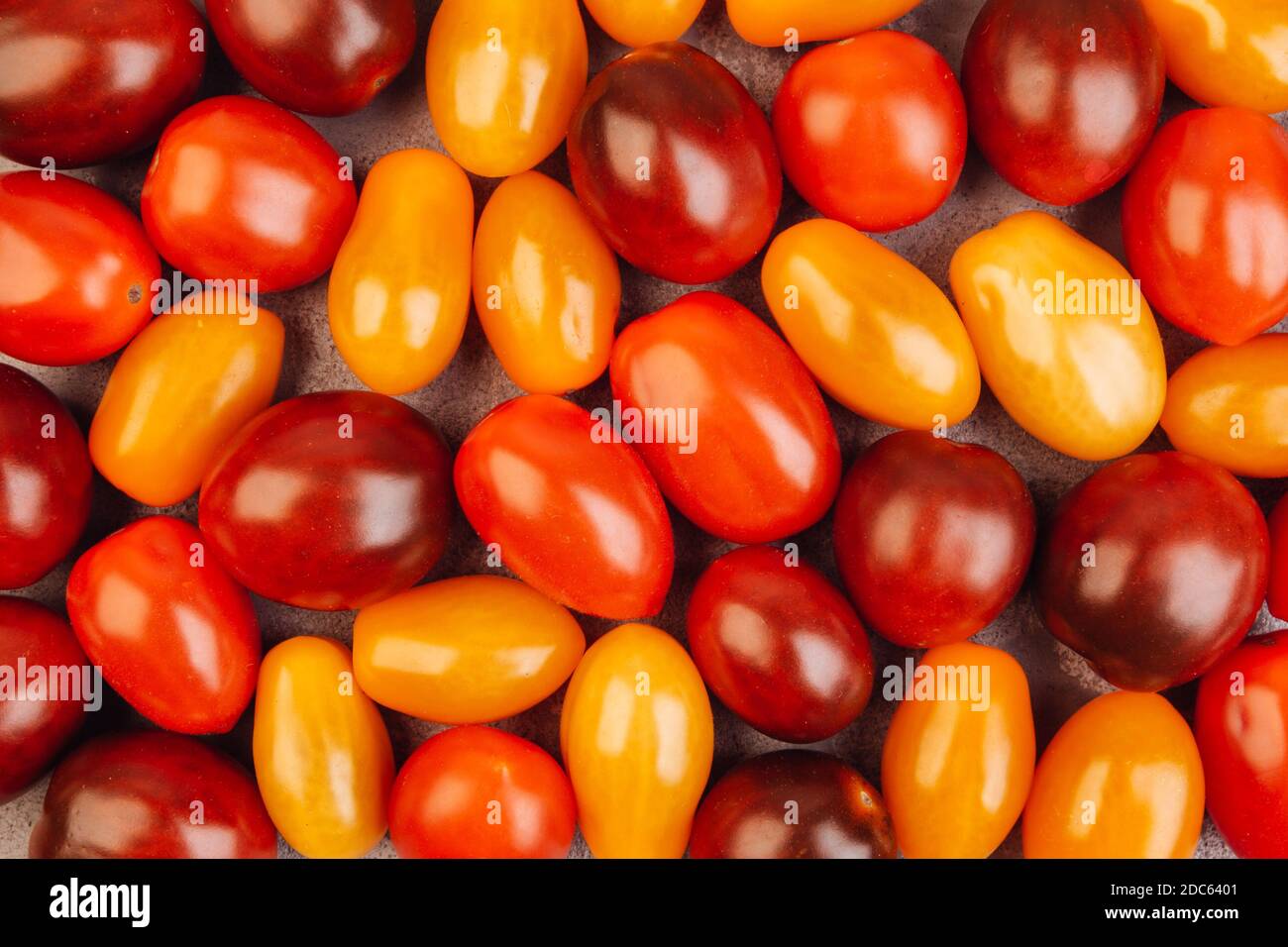 Cherry tomatoes on gray marble background. Stock Photo