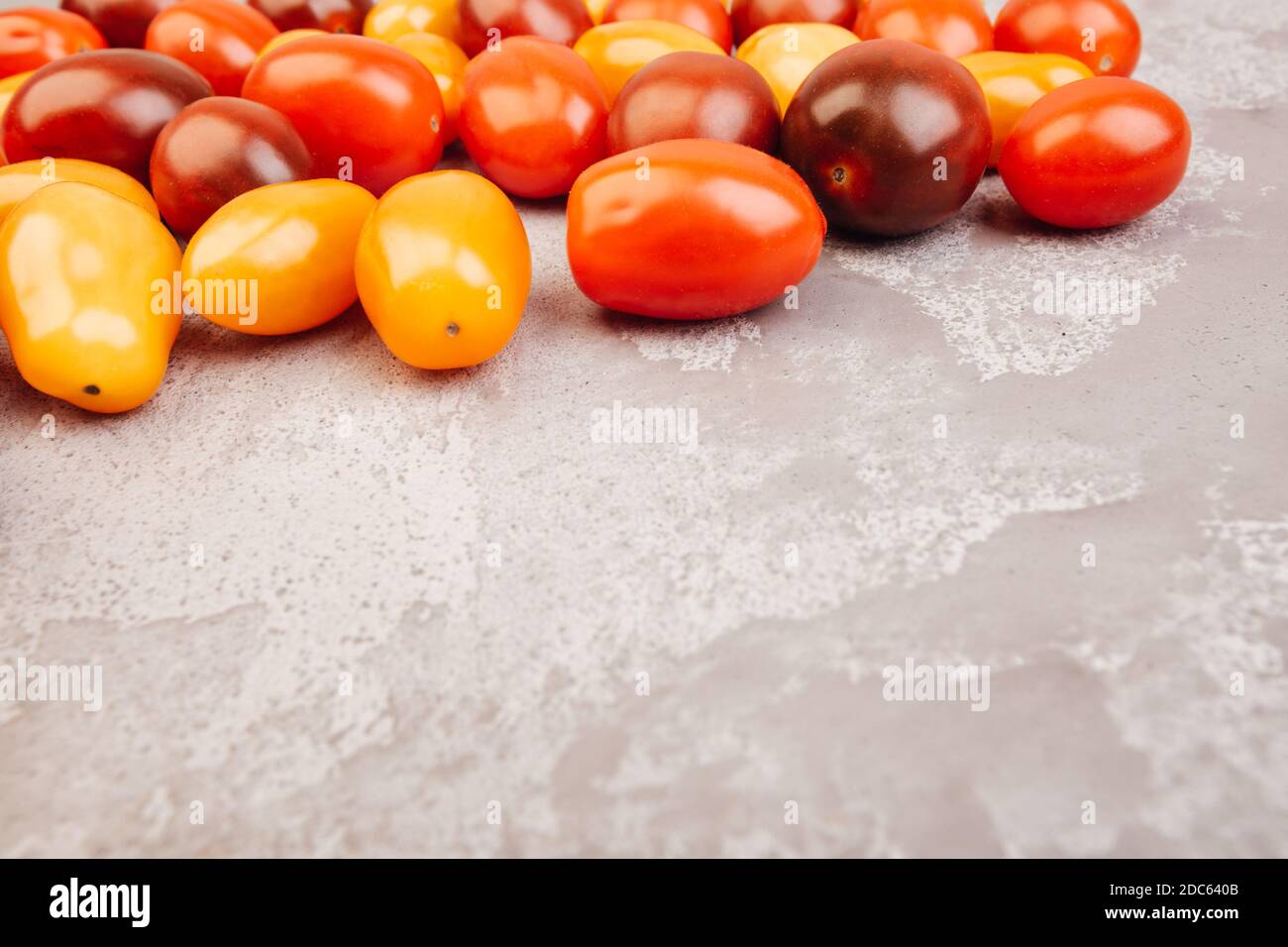 Cherry tomatoes on gray marble background. Copyspace Stock Photo - Alamy