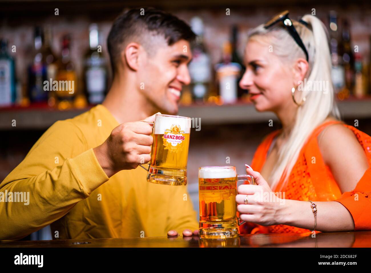 Beer Party Young couple enjoying hot summer day at a rooftop party