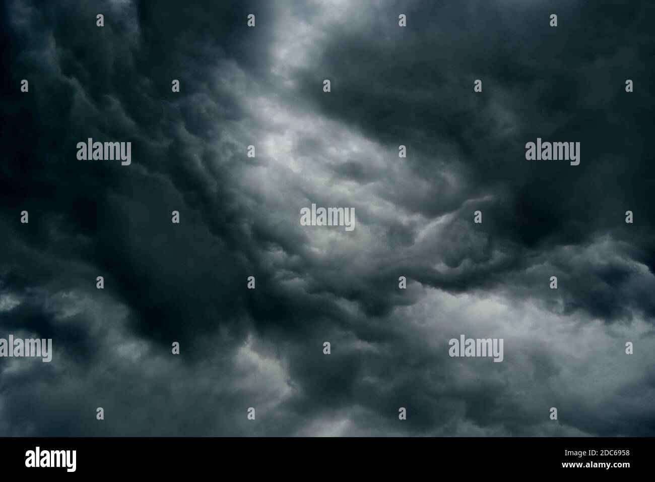 Dramatic Thunderstorm Clouds To Dark Sky.Dark sky and black clouds, dramatic storm clouds before rain. Stock Photo