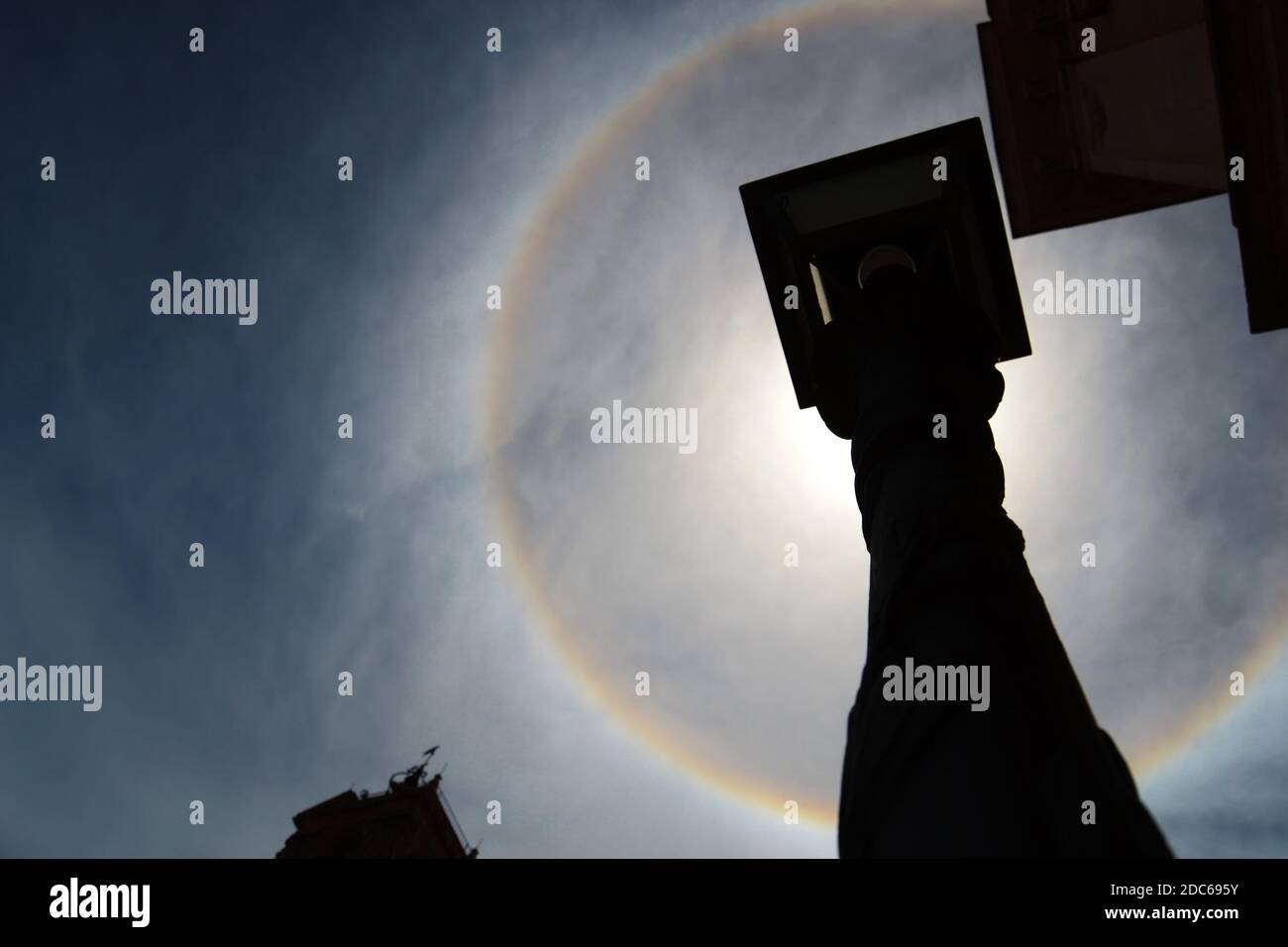 22 degree halo.rainbow ring around the sun Stock Photo