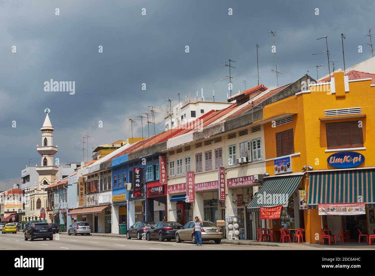 Rain clouds over Geylang Road and the Khadijah Mosque (Masjid Khadijah) in Geylang, Singapore, traditionally a Muslim / Malay quarter of the city Stock Photo