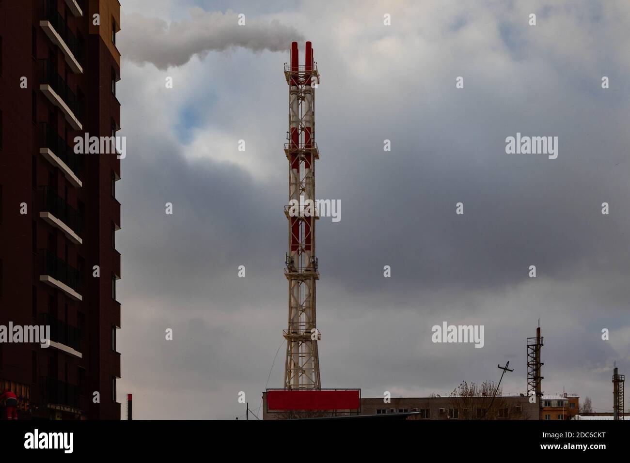 The cityscape, the high chimney boiler room against the sky. Stock Photo