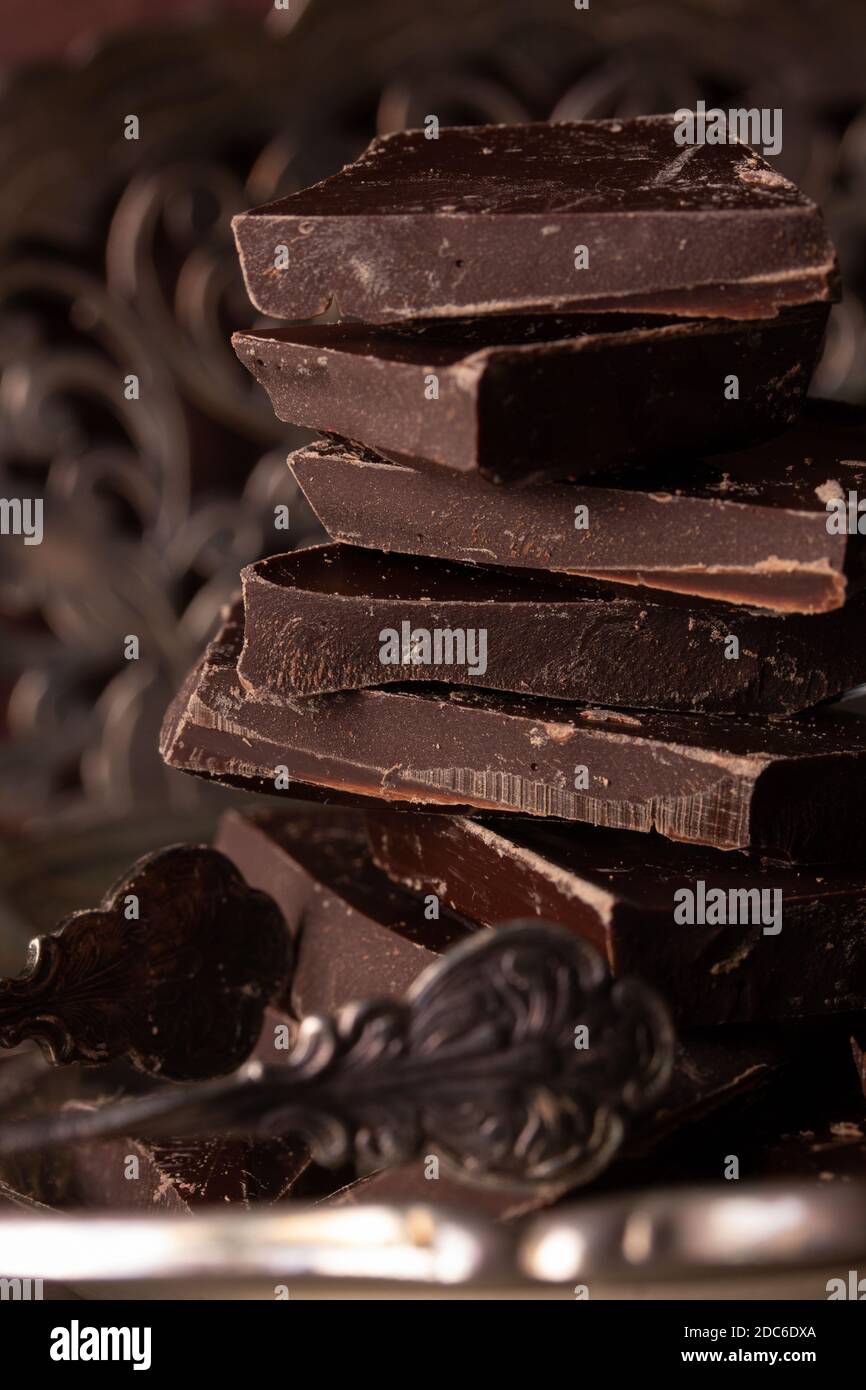 Pieces of delicious dark chocolate stacked on top of each other Stock ...