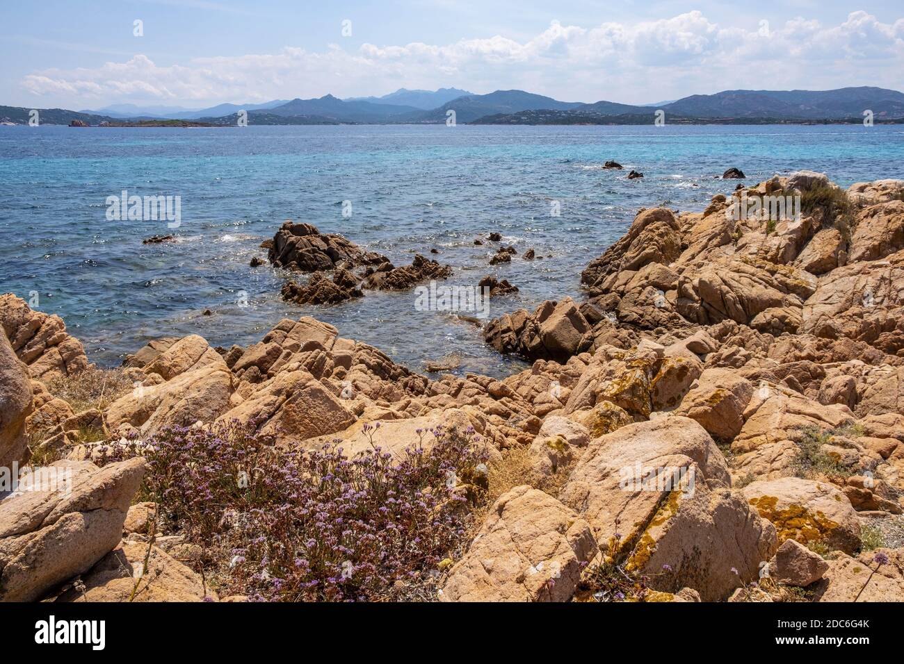 Panoramic view of Spalmatore di Terra peninsula of Marine Protected Area natural reserve with seashore rocks of Isola Tavolara island on Tyrrhenian Se Stock Photo