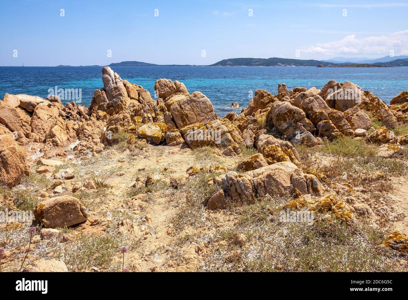Panoramic view of Spalmatore di Terra peninsula of Marine Protected Area natural reserve with seashore rocks of Isola Tavolara island on Tyrrhenian Se Stock Photo