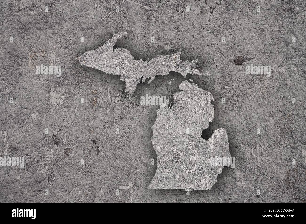 Map of Michigan on weathered concrete Stock Photo - Alamy