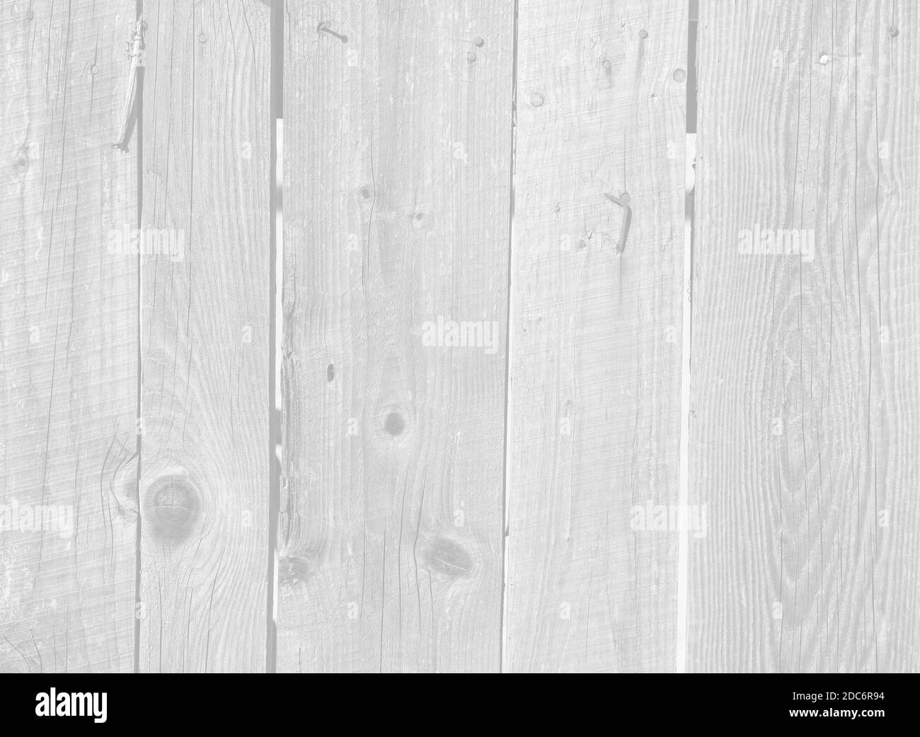Close up of old gray wooden fence panels. Image in light gray tonality ...