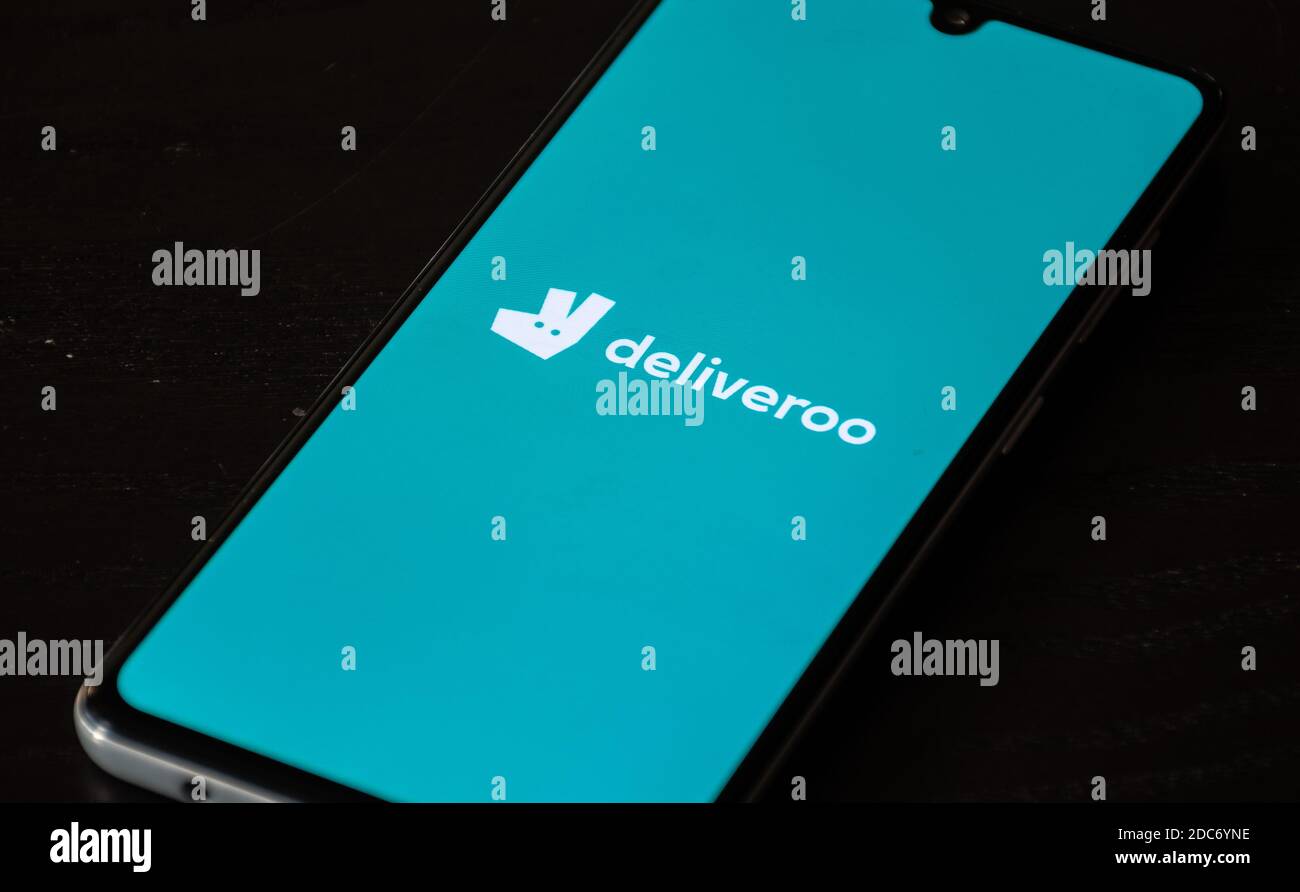 Deliveroo, food ordering and delivery service. Takeaway food during Covid or Coronavirus pandemic, app on the smartphone Stock Photo