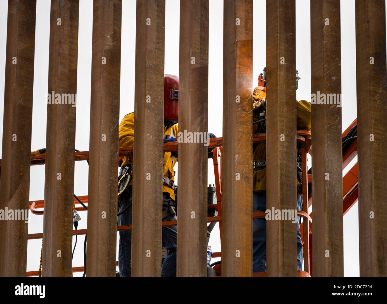 Construction workers at a build site for a section of the U.S. - Mexican border wall, known at the Trump Wall October 28, 2020 near McAllen, Texas. Stock Photo