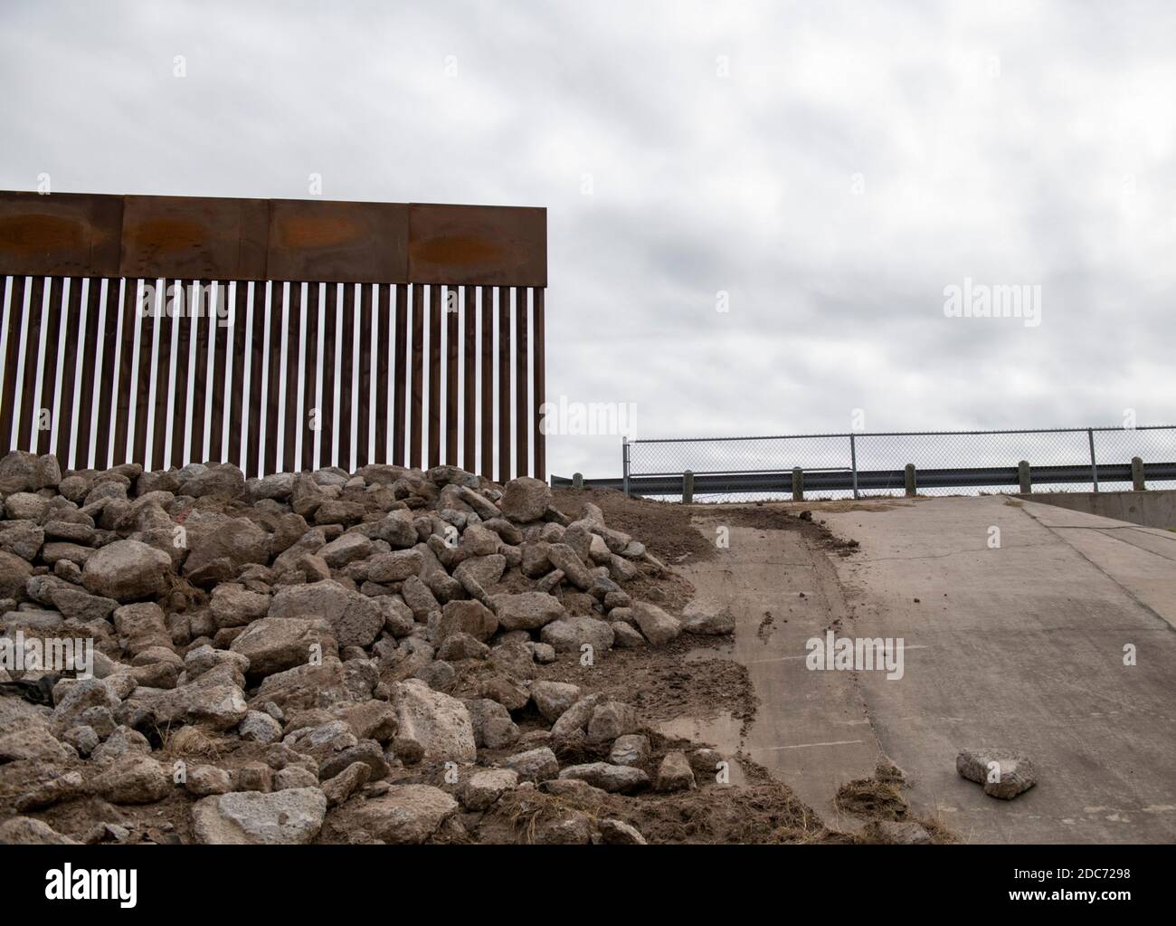 A section where the new Trump Wall meets the old barrier along the U.S. - Mexican border wall October 28, 2020 near McAllen, Texas. Stock Photo