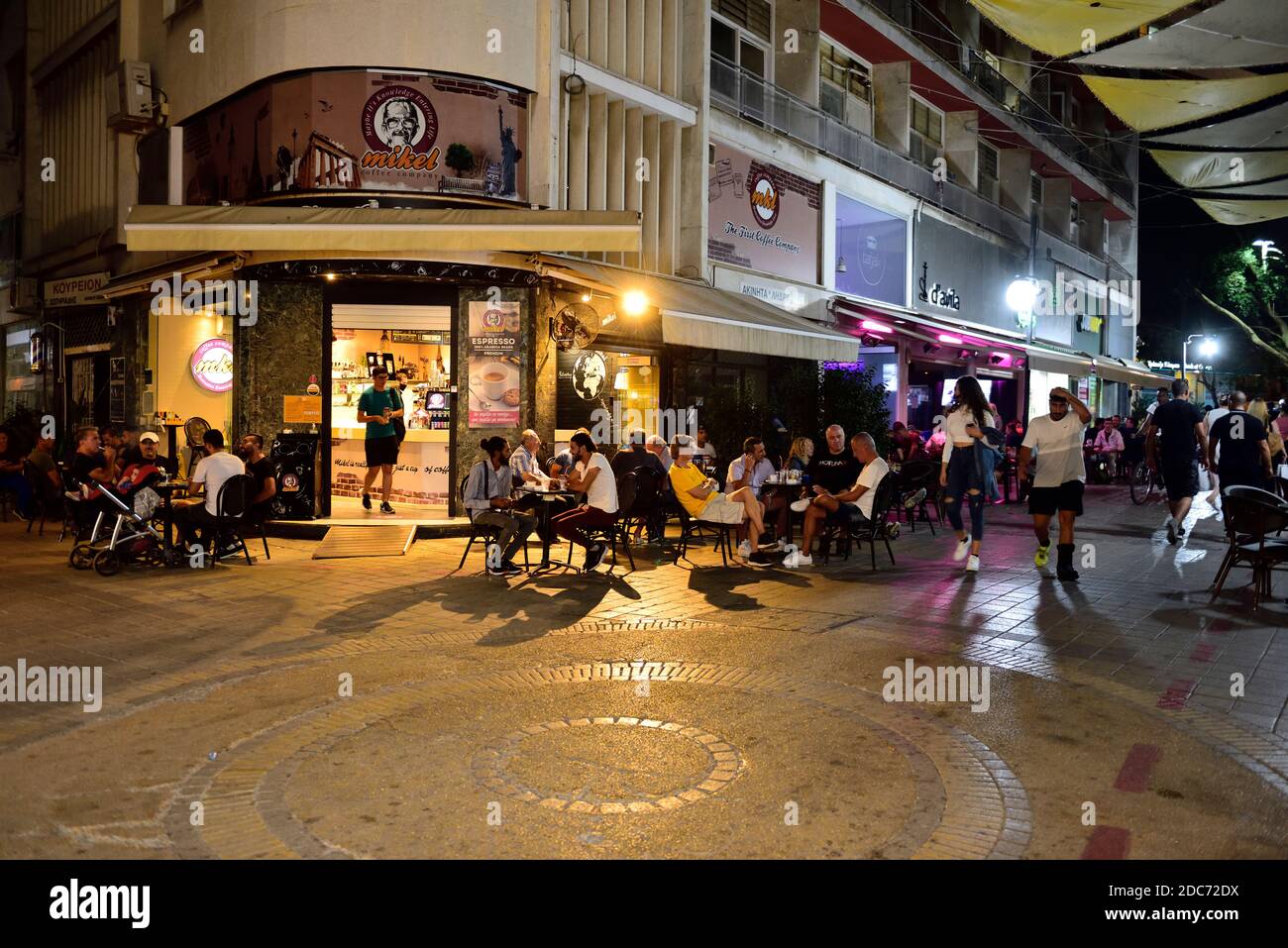 Having a coffee and meeting friends outside on pavement tables in