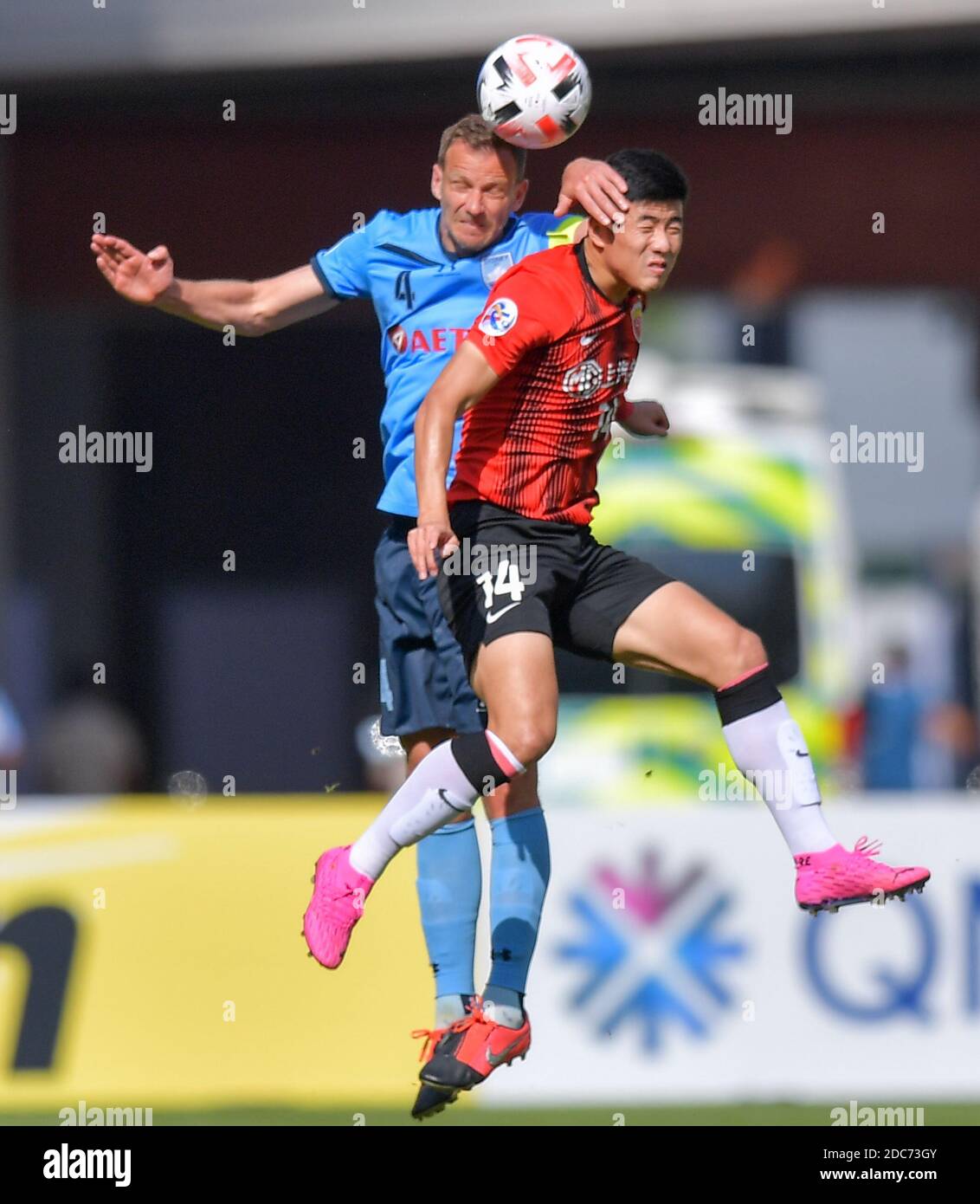 Doha, Qatar. 19th Nov, 2020. Shanghai SIPG's Li Shenglong (R) vies with Sydney FC's Alex Wilkinson during the group H match between Sydney FC of Australia and Shanghai SIPG of China at the AFC Champions League 2020 in Doha, capital of Qatar, Nov. 19, 2020. Credit: Nikku/Xinhua/Alamy Live News Stock Photo