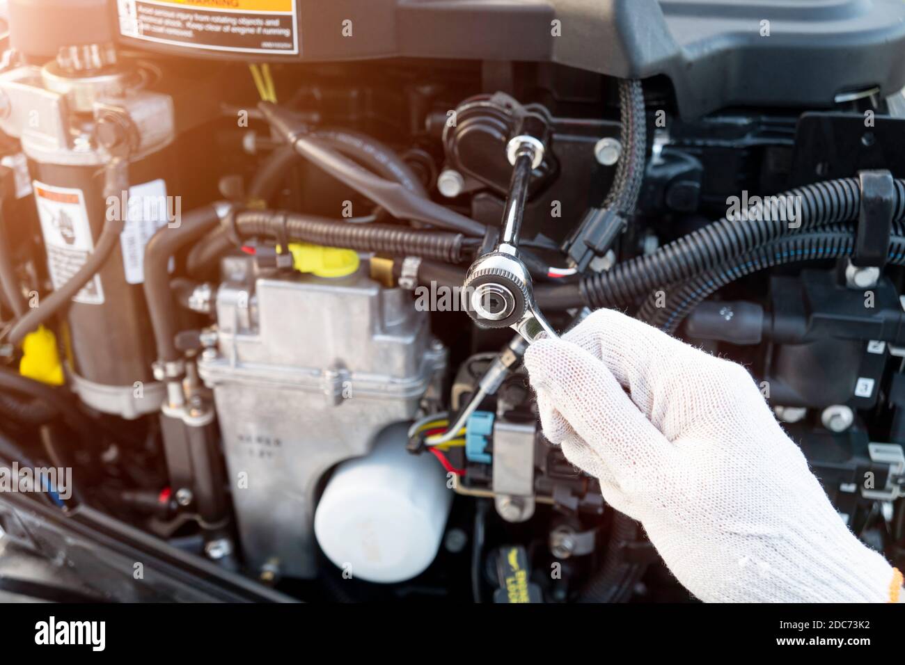 Repairing outboard marine engine. Motorboat engine seasonal service and