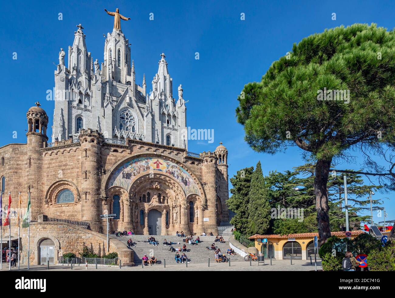 People relaxing in front of Tibidabo church on mountain in Barcelona Stock Photo