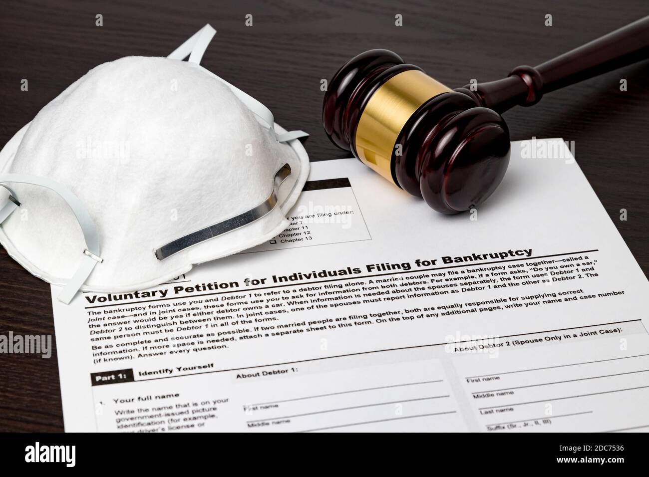 Bankruptcy petition for individuals with gavel and N95 face mask. Concept of financial and unemployment crisis,  debt, economy recession ,pandemic Stock Photo