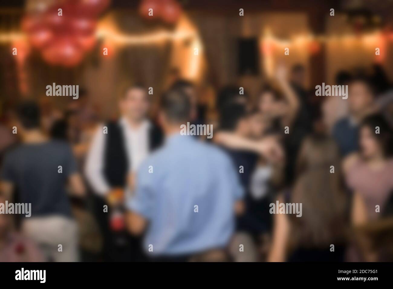 Birthday party, night out or New Year celebration. Blurred image for background use. Stock Photo