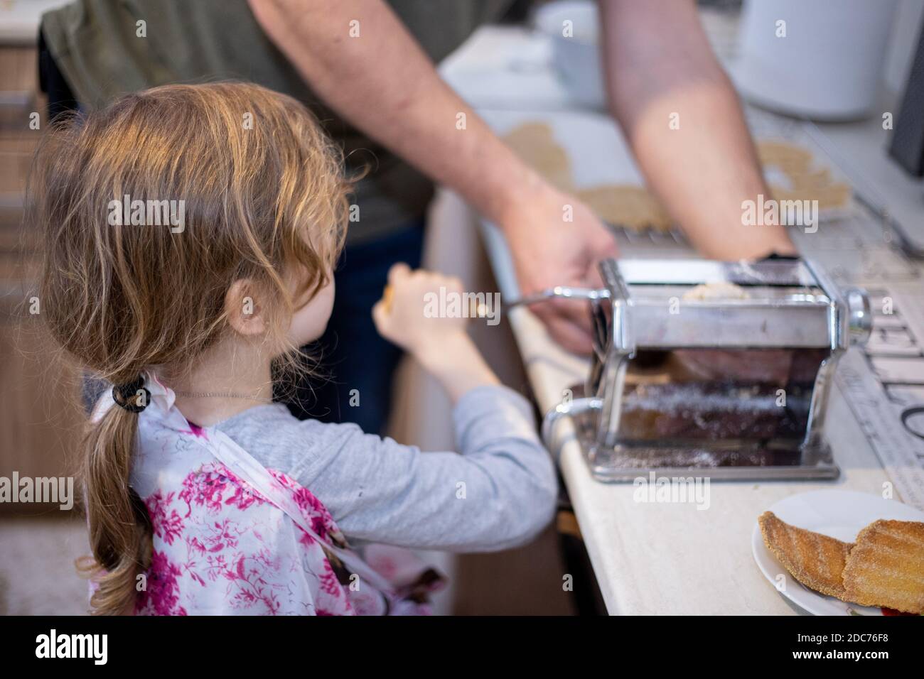 Daughter and father baking together Stock Photo