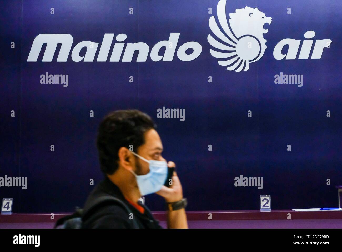 Kuala Lumpur, Malaysia. 18th Nov, 2020. A man wearing a face mask walks