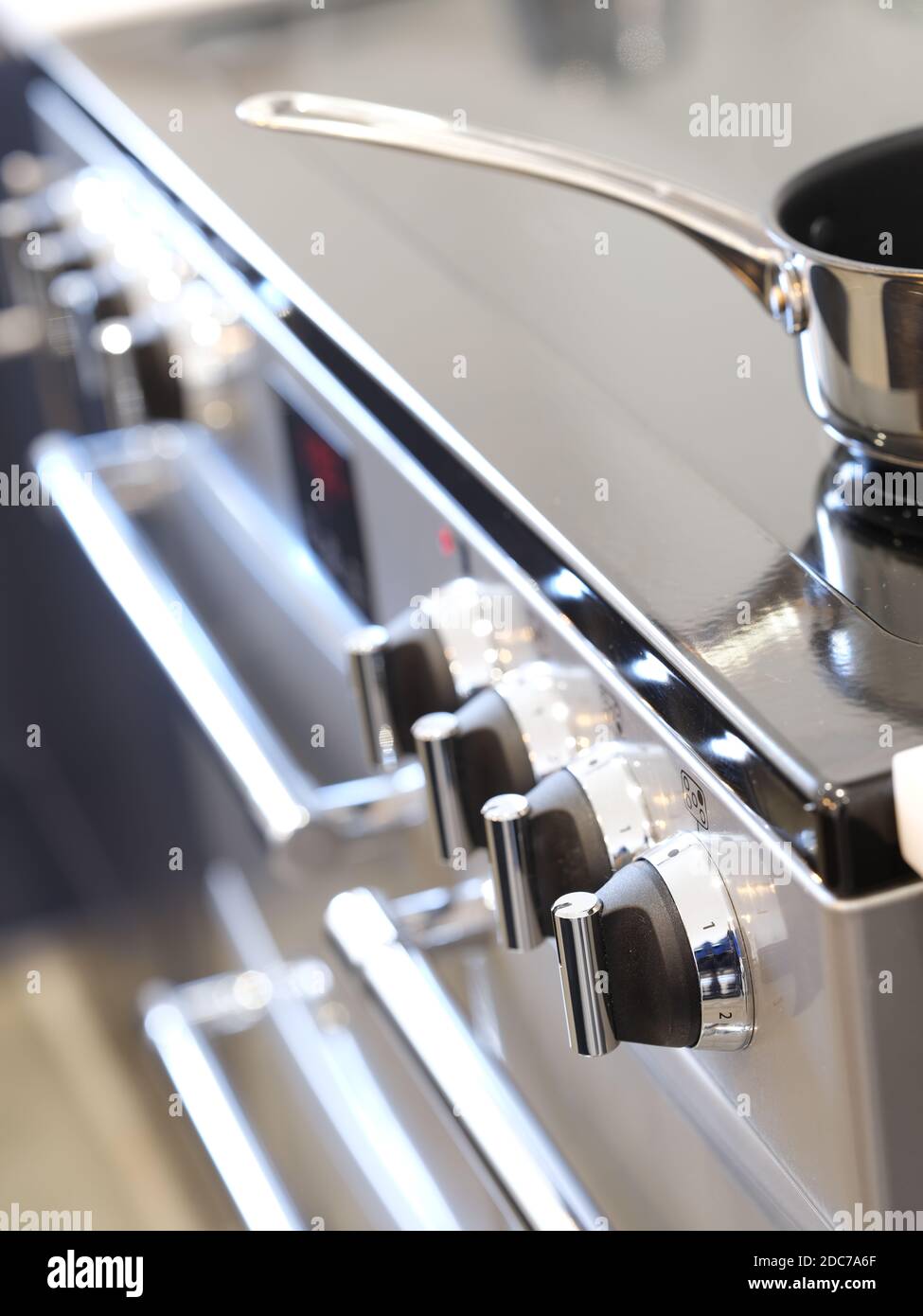 Electric oven and hob cooker in designer kitchen Stock Photo Alamy