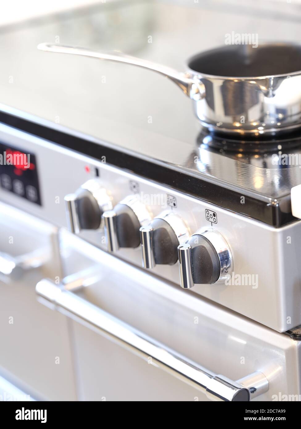 Electric oven and hob cooker in designer kitchen Stock Photo Alamy