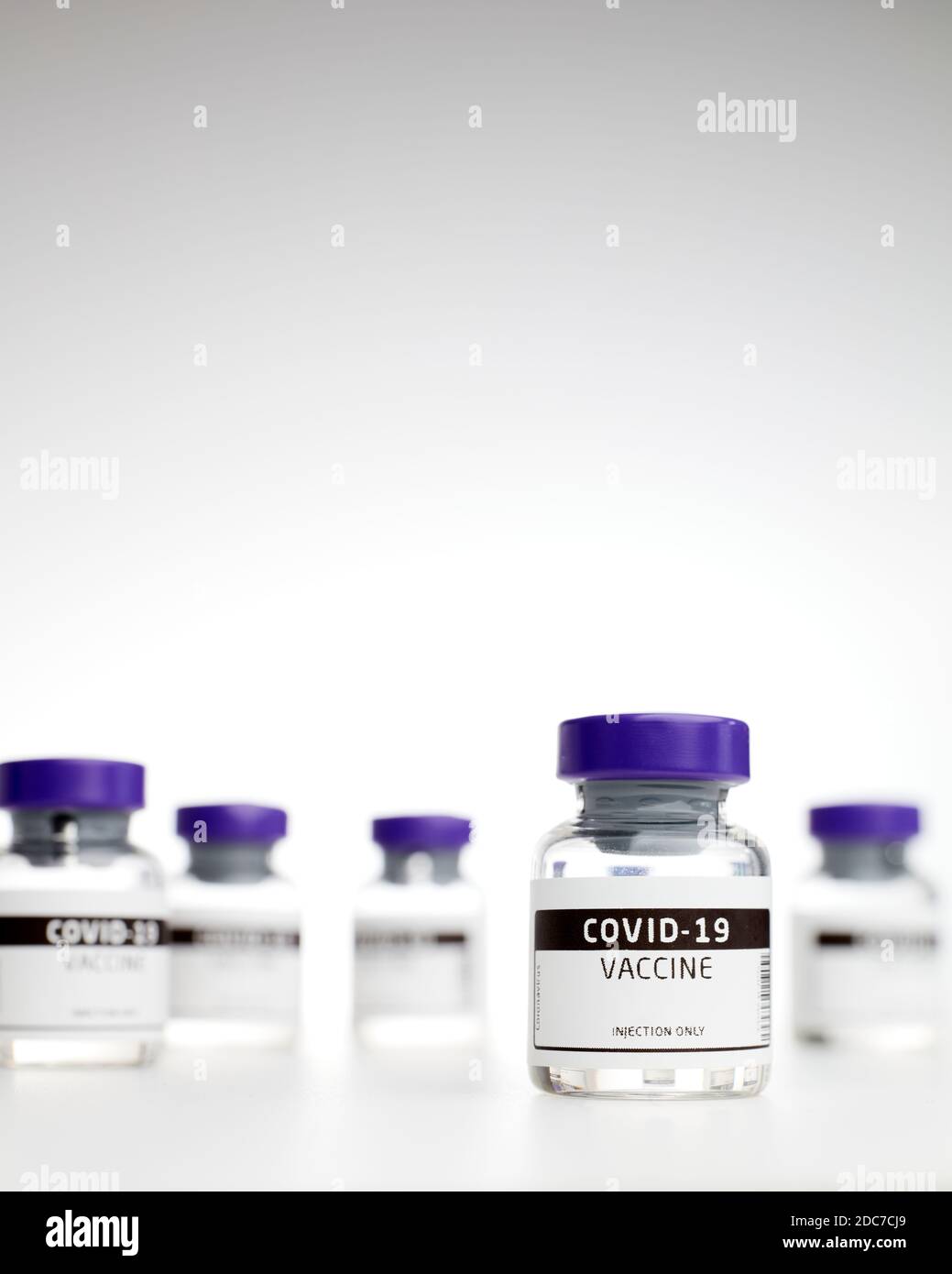 Closeup of vaccine phials for the treatment of coves-19 / coronavirus  on white background Stock Photo