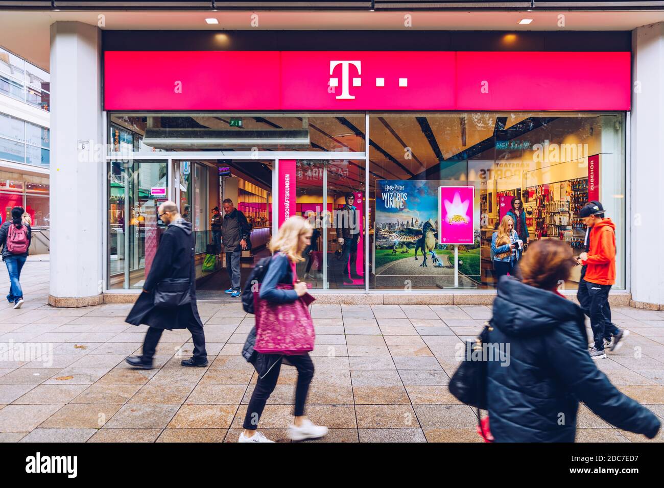 Stuttgart, Germany - October 19, 2019: T-Mobile store with people. T-Mobile is the brand name used by the mobile communications subsidiaries of the Ge Stock Photo