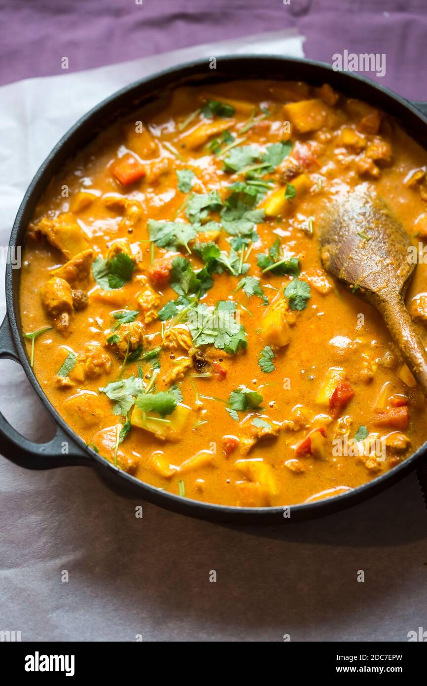 Chicken tikka masala with red peppers and mango chutney Stock Photo