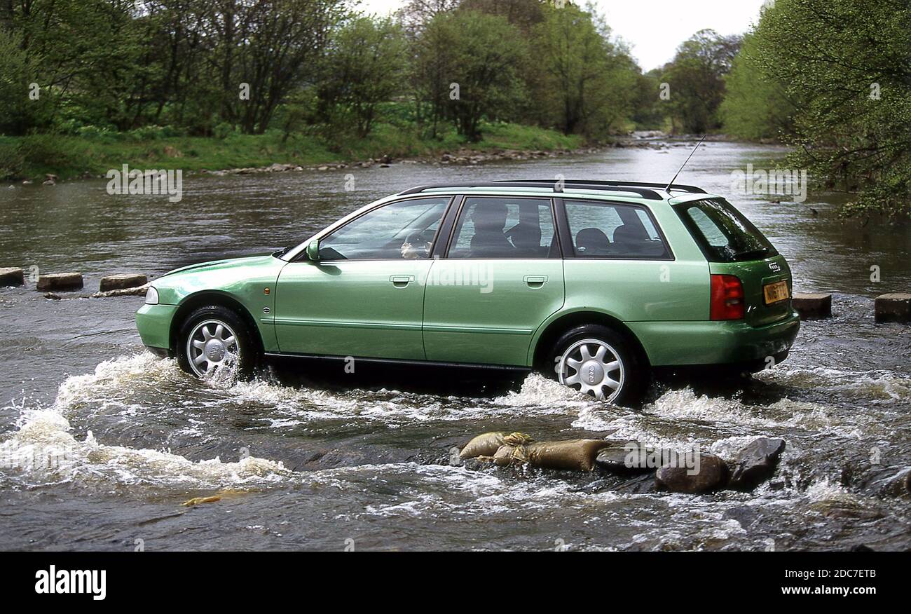 Driving through a river Ford in a 1996 Audi A4 Avant Stock Photo
