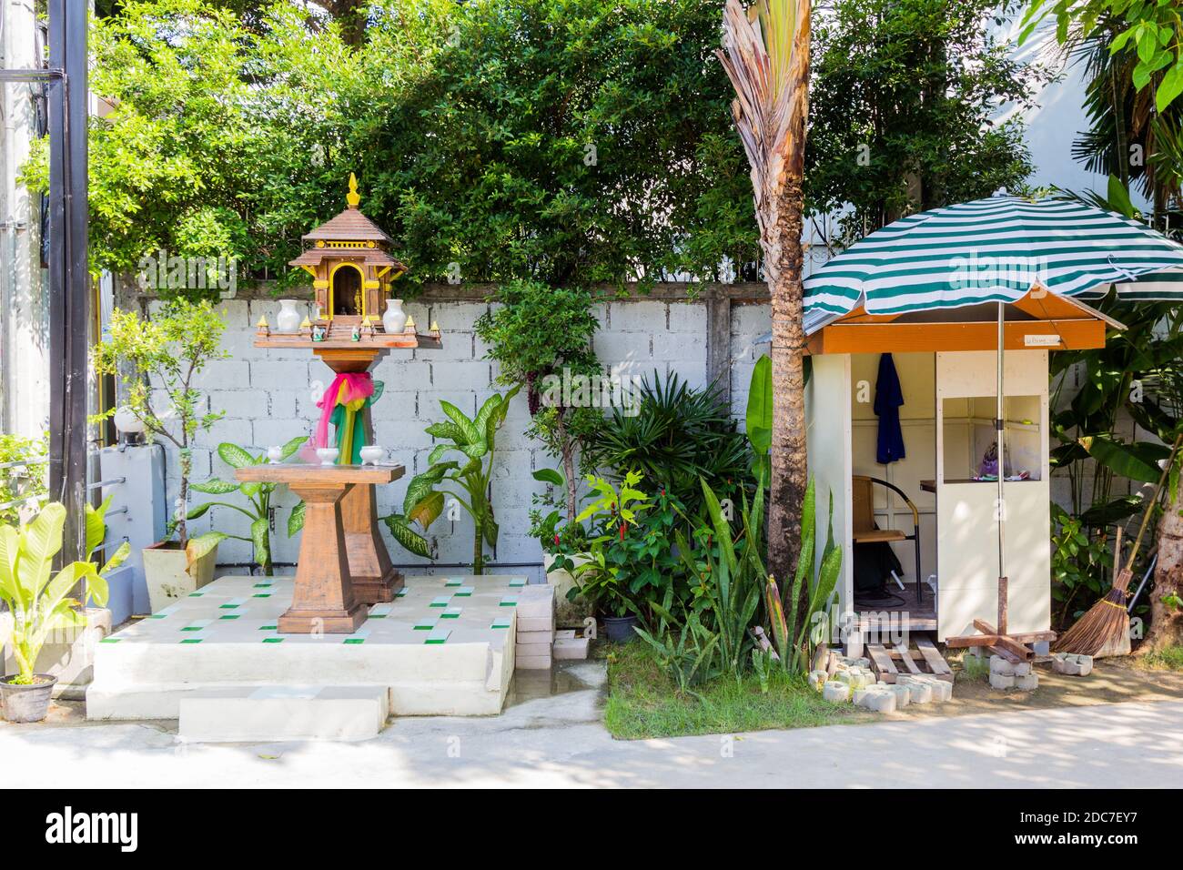 A Thai spirit house is a common sight in the streets of Thailand Stock Photo