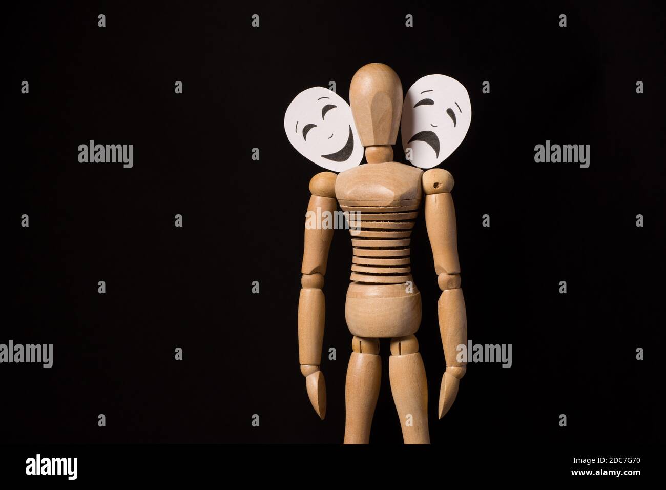 A wooden mannequin in a ballet pose, on it's base, on a white surface Stock  Photo - Alamy