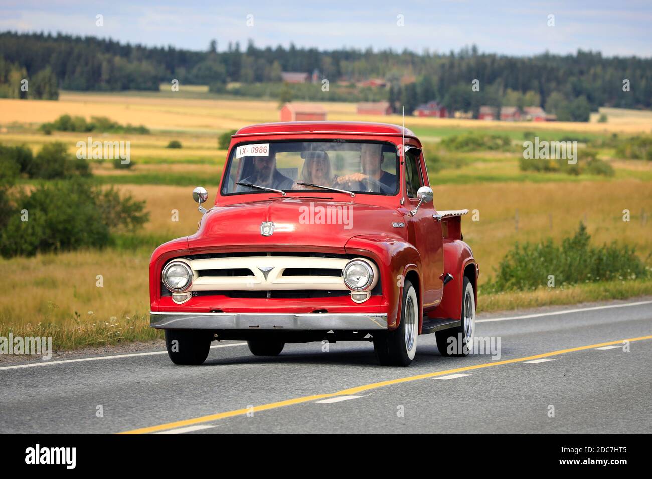 Driving red Ford F100 pickup truck, early to mid 1950s, Maisemaruise 2019 car cruise. Vaulammi, Finland. August  3, 2019. Stock Photo