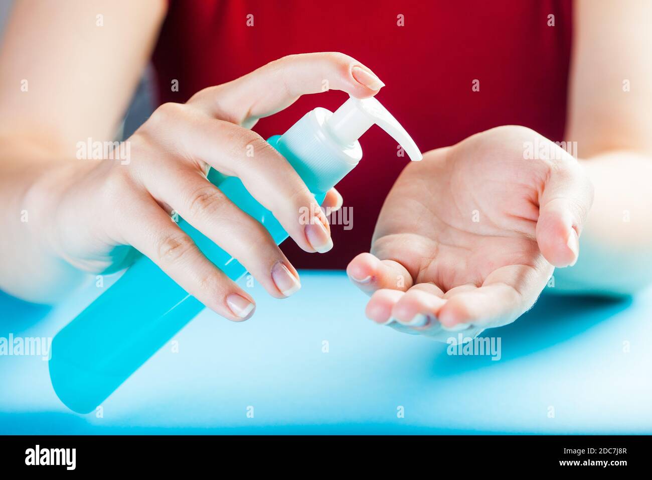 Caucasian woman applying dry hand wash sanitizer gel,protection from transfer & spread of virus disease,global Coronavirus COVID-19 pandemic outbreak Stock Photo