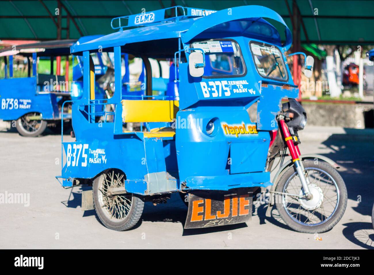A blue tricycle, a local passenger vehicle in Leyte, Philippines Stock Photo