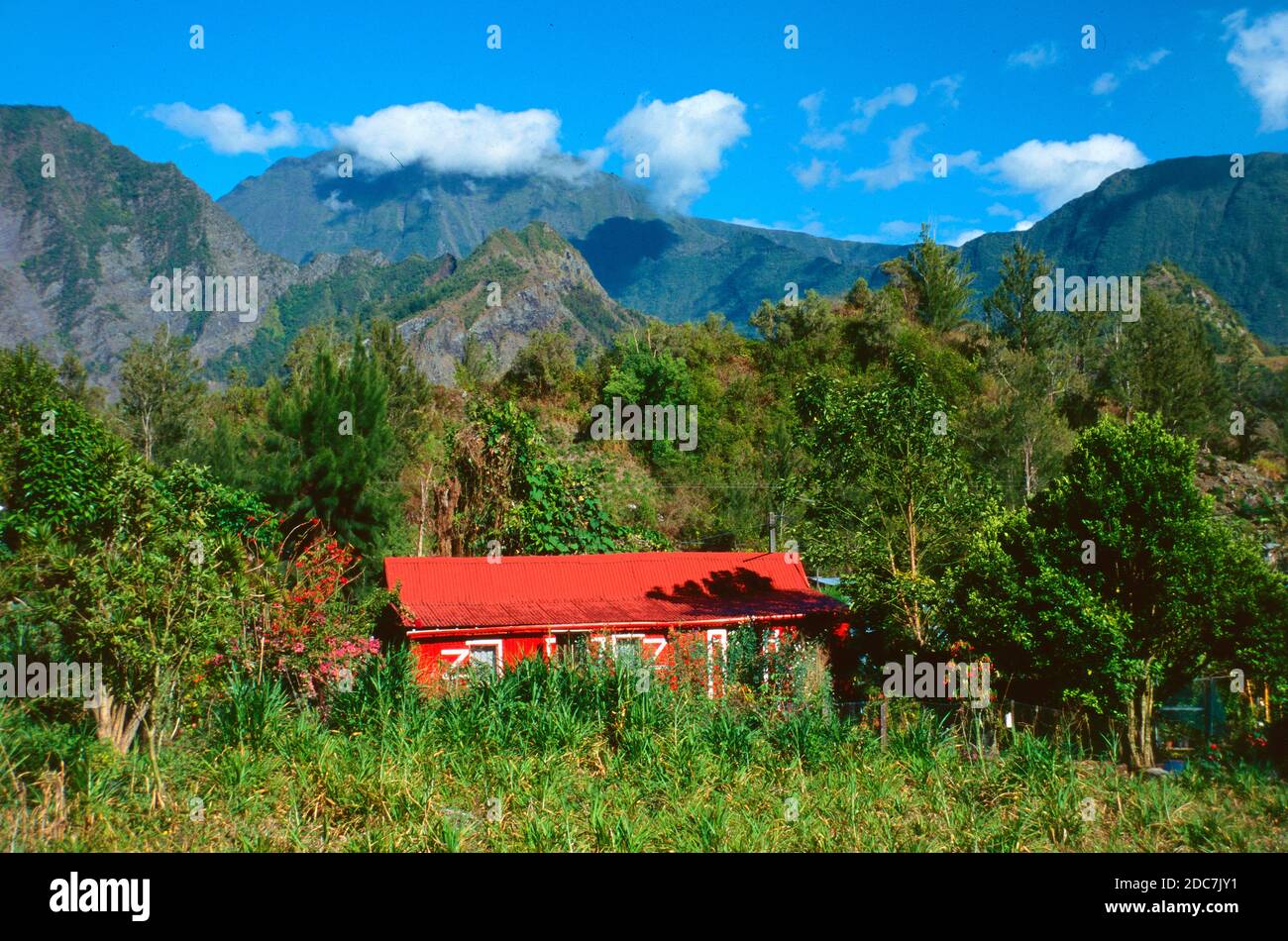 Bright Red Creole House or Bungalow known as a Case in a Landscape Setting Salazie La Réunion or Reunion Island France Stock Photo