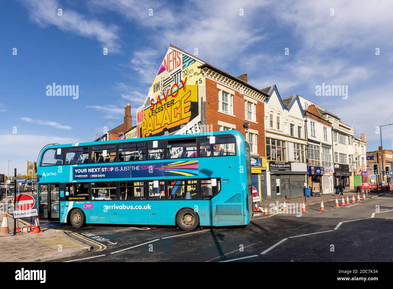 An Arriva bus turning into Savoy Street, a recently created road in Leicester, with artwork inspired by Leicester’s lost art deco cinemas. Stock Photo