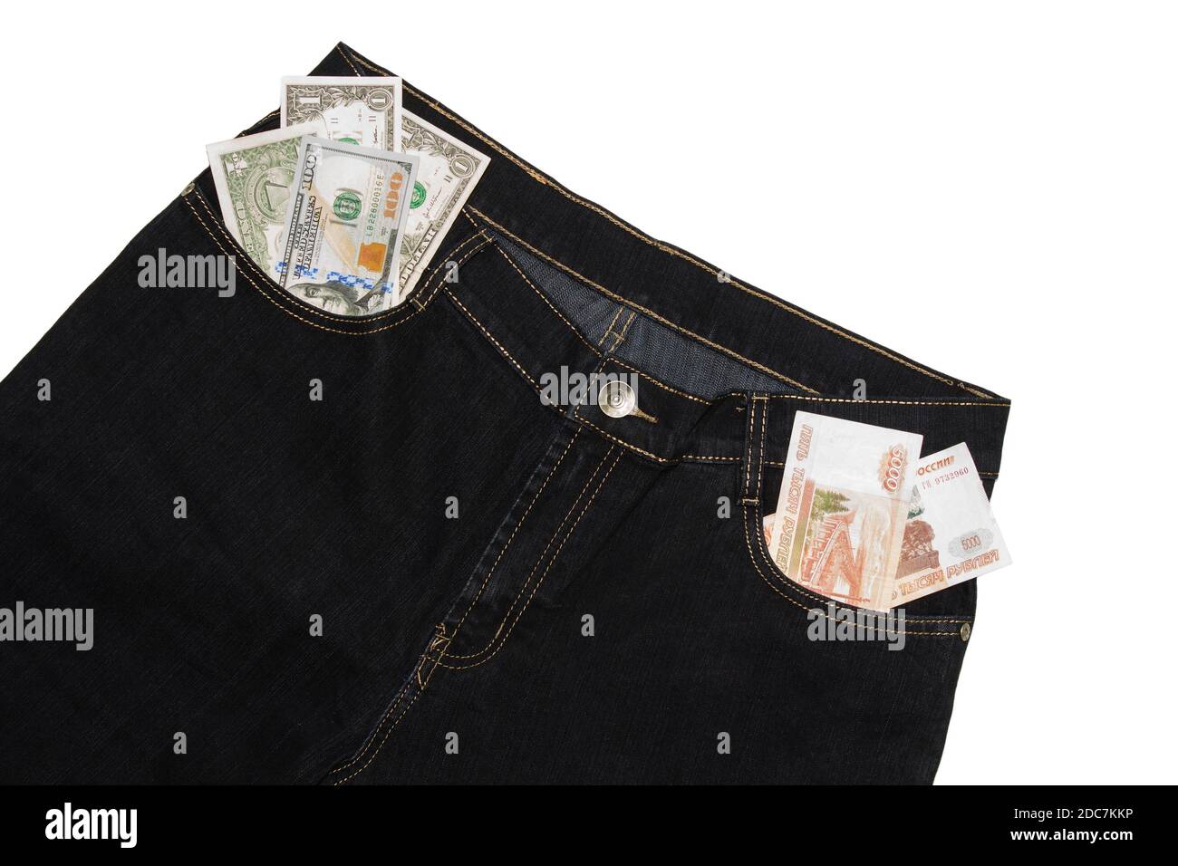 Macro shot of trendy jeans with american 100 dollar bill on its pocket. Stock Photo