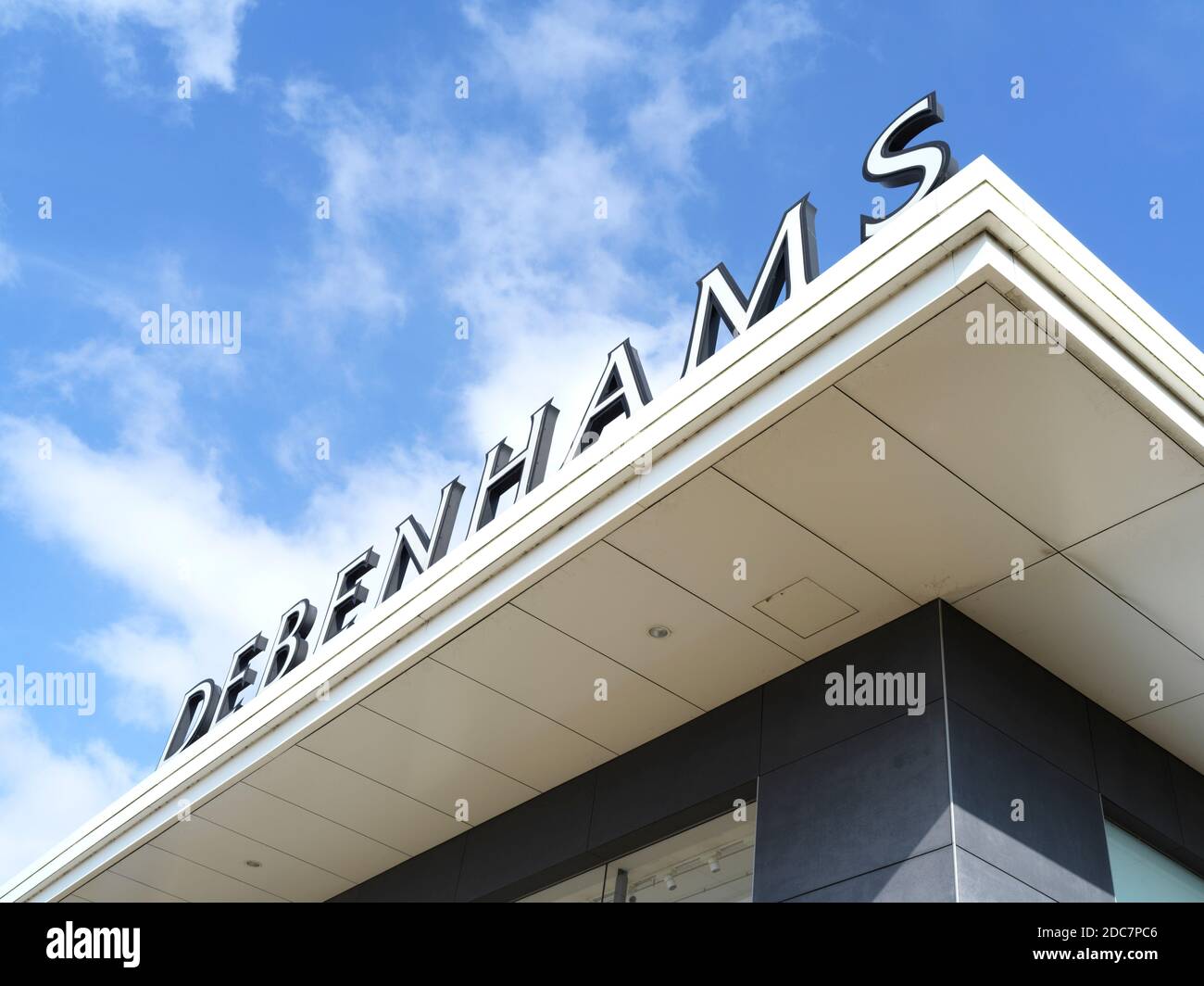 Looking up on a Debenhams sign on a closed branch of the shop in Rugby Stock Photo