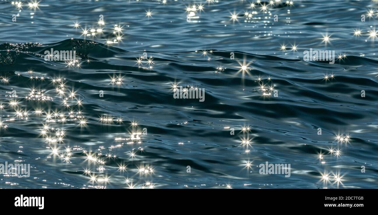 Sparkles of light reflecting on sea water Stock Photo Alamy