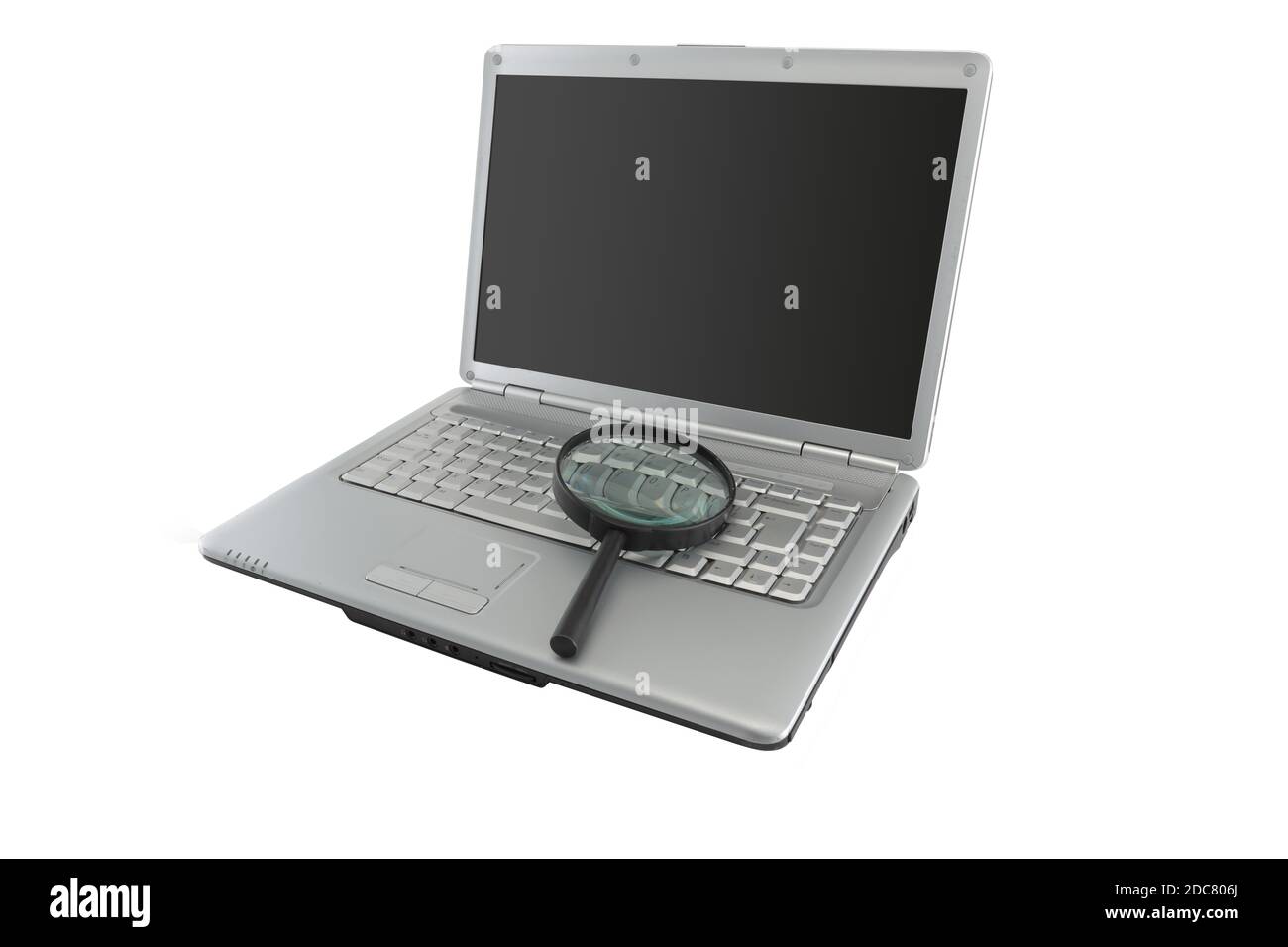 Data security concept magnifying glass on laptop PC with dark screen for copy space Stock Photo