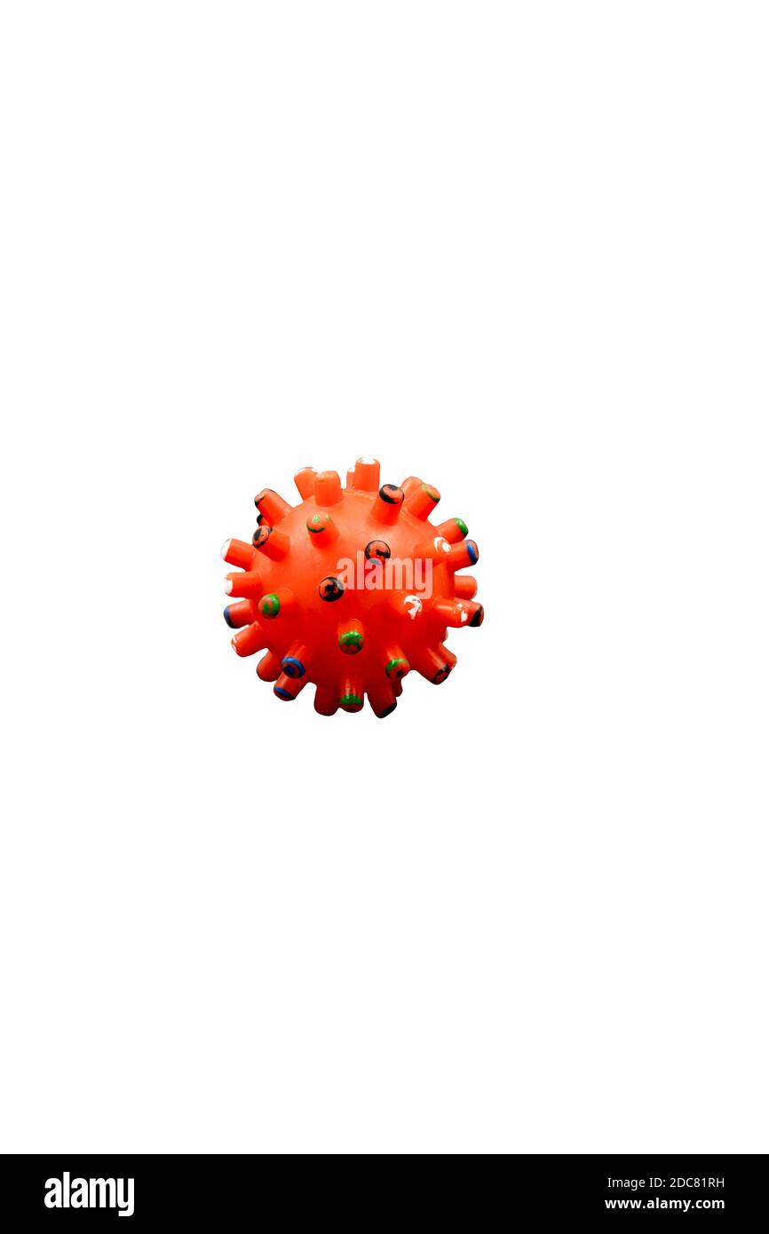 Isolated coronavirus mockup orange color on white background. Vertical, abstract, dog toy