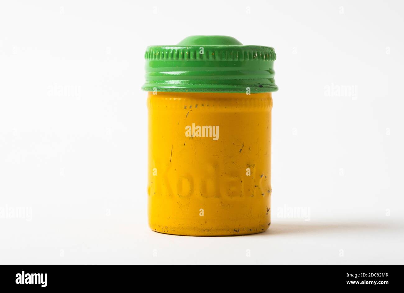 Metal film cannister from Kodak, dating from the 1950s; for holding 35mm film.The green lid colour refers to the enclosed film being Tri-X type. Stock Photo