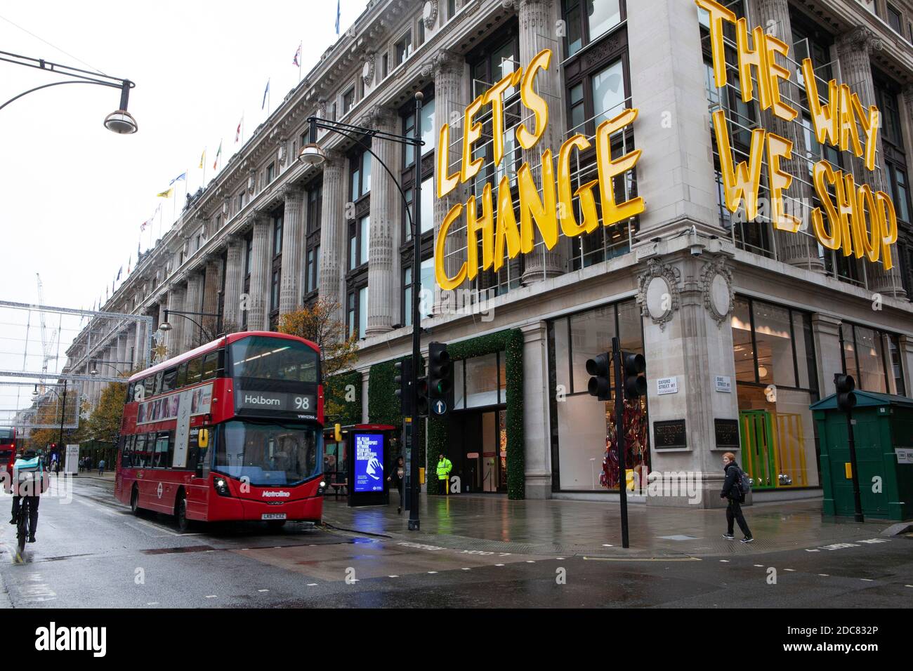 London, UK, 19 November 2020: Despite England's lockdown and rainy weather  some people go window-shopping in London's West End. When Selfridges used  the slogan 'Let's Change The Way We Shop' this is